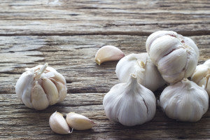 Garlic on the wooden background - flu