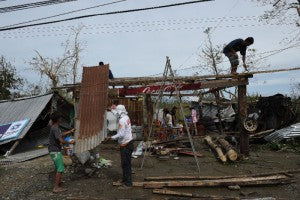 fixing-a-house-after-haima-via-yahoo-news Super Typhoon Haima
