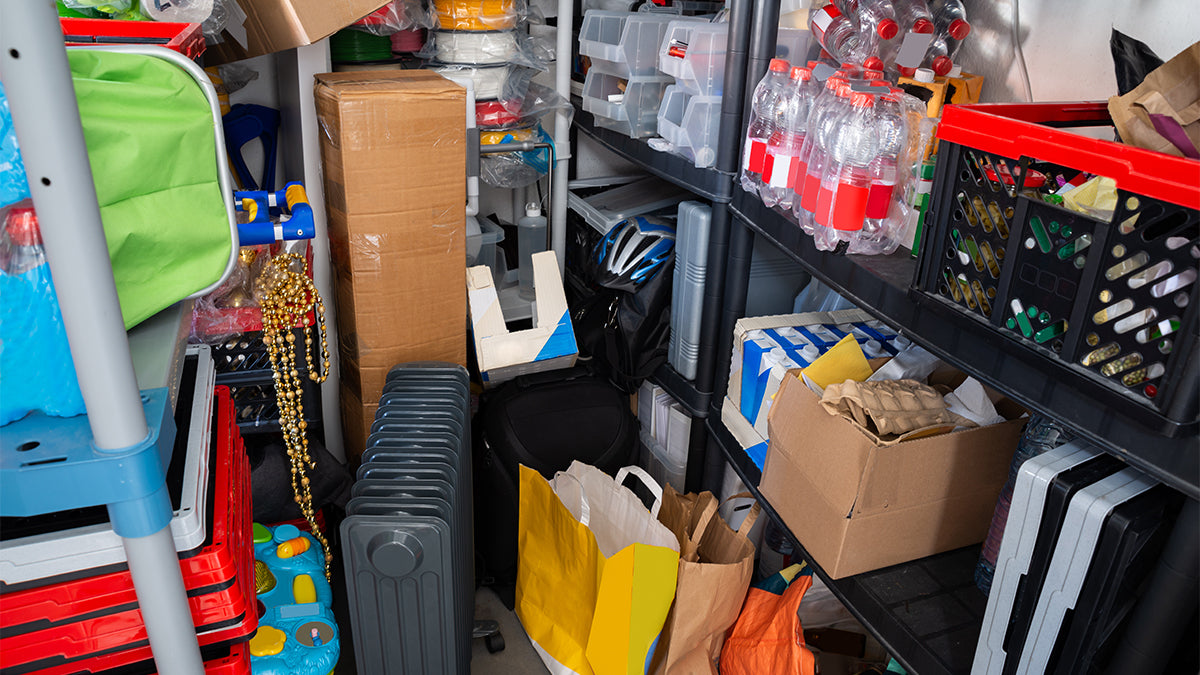 A room overly packed with overflowing shelves.