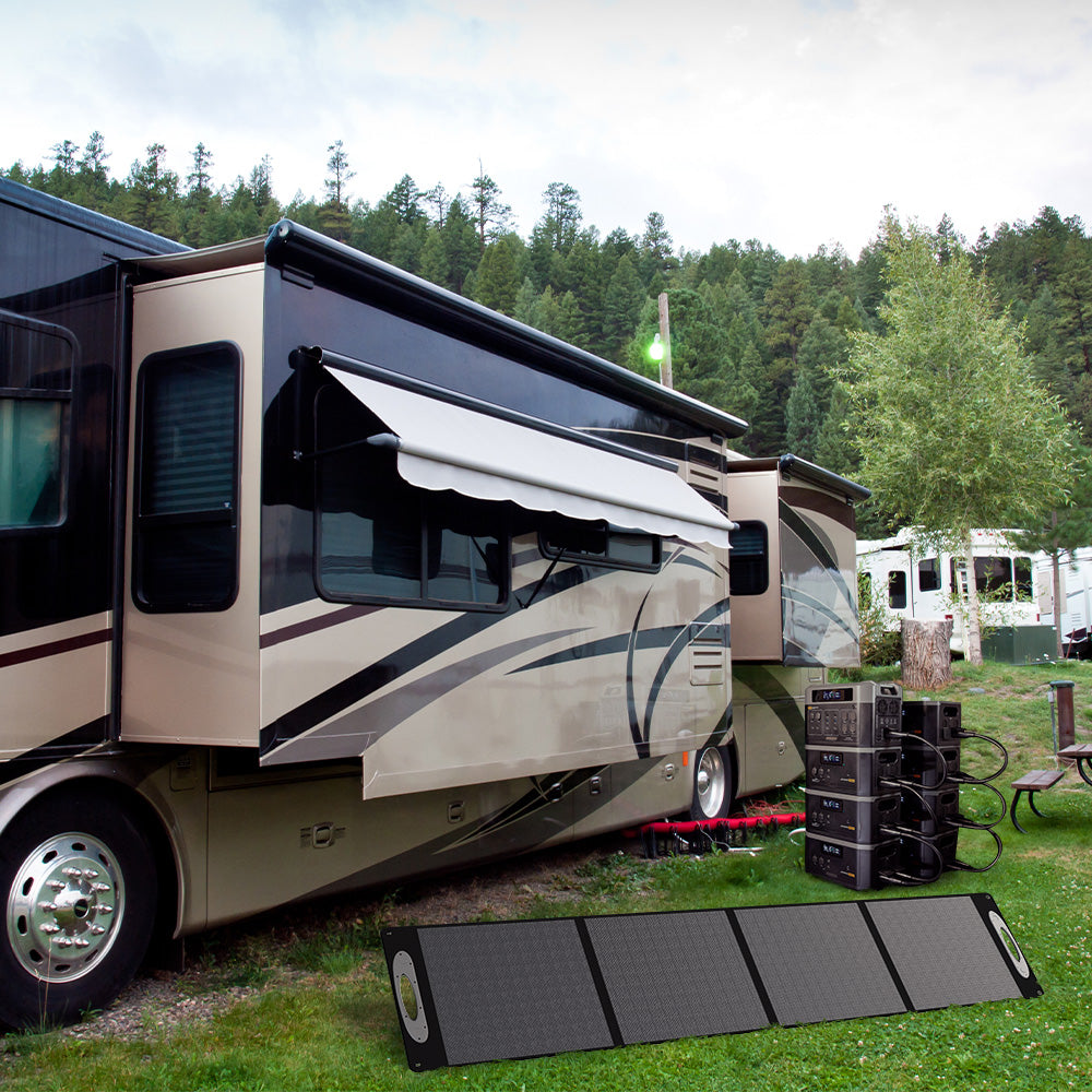 Complete Grid Doctor solar power system with unfolded solar panel, 2200 battery, and 'Power Tower' featuring multiple 2200XP batteries, efficiently powering an RV in a sunny outdoor setting. (7404114083980)