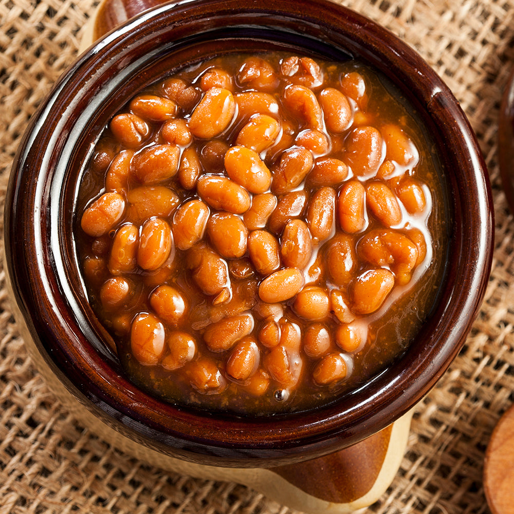 Bowl of Barbecue Baked Beans Garnished in a Rustic Wooden Bowl"