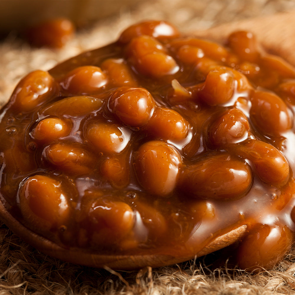 Close-up of Barbecue Baked Beans with Thick Sauce and a Rich Texture in a Spoon