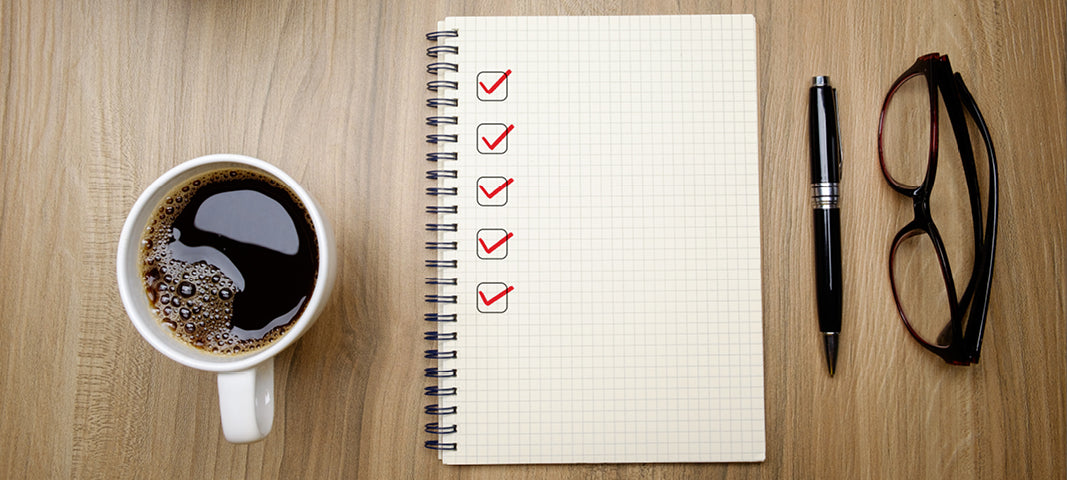 coffee next to a checklist