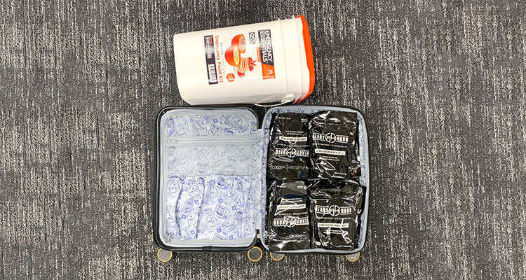Suitcase full of emergency food pouches