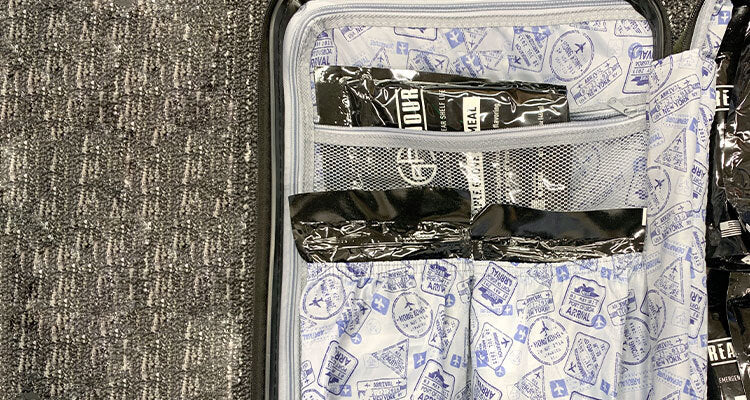 emergency food pouches inside luggage side pockets