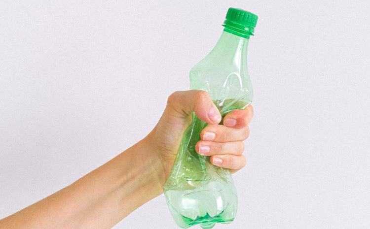 hand holding empty bottle