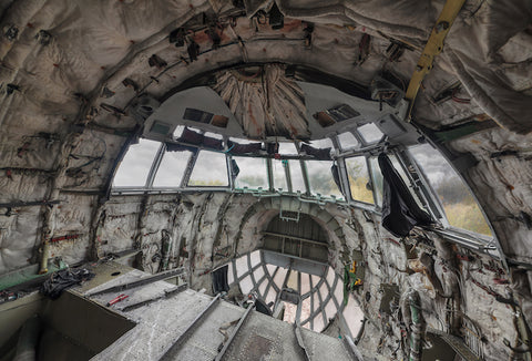 Inside of a severely damaged cockpit of a crashed plane.