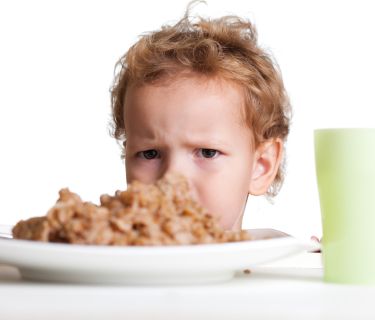 child frustrated with meal