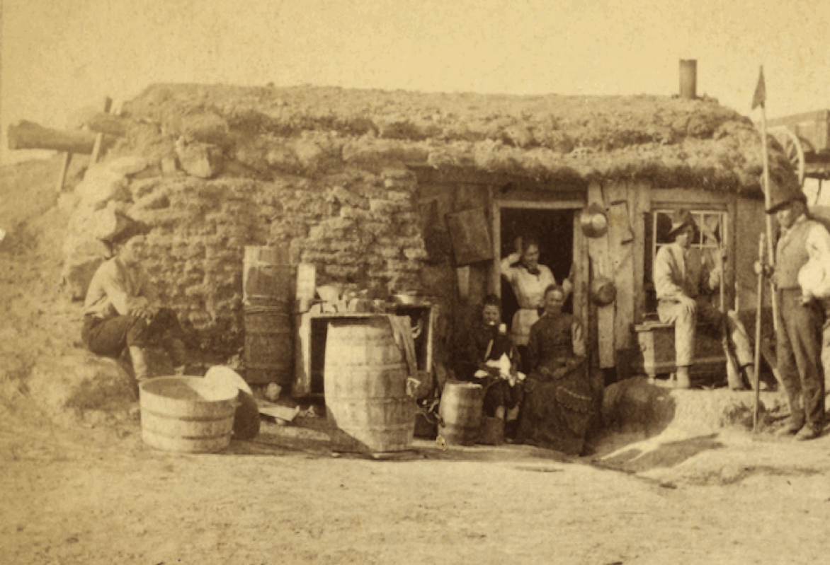pioneer family and a sod house
